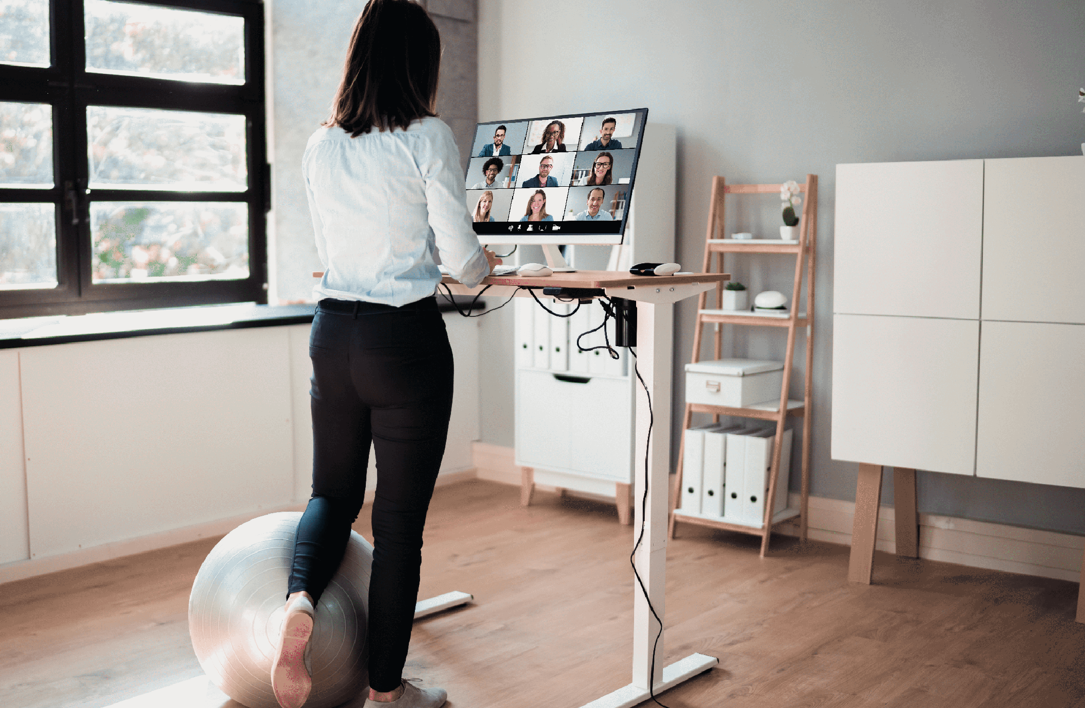 Woman working at a home stand up desk